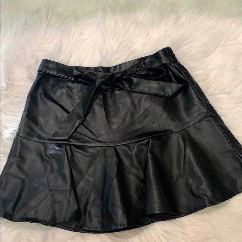 Black leather ruffled mini skirt